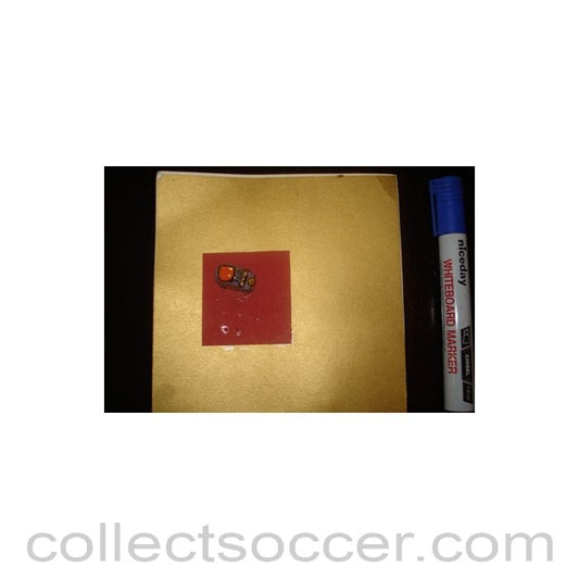 A greetings card with a tiny taxi car football souvenir